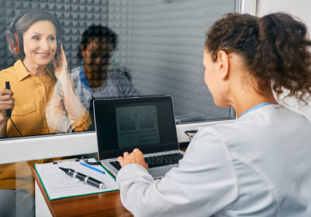 IMG_5159 Mature woman getting a hearing test at audiology center. Audiometry, hearing checkup
